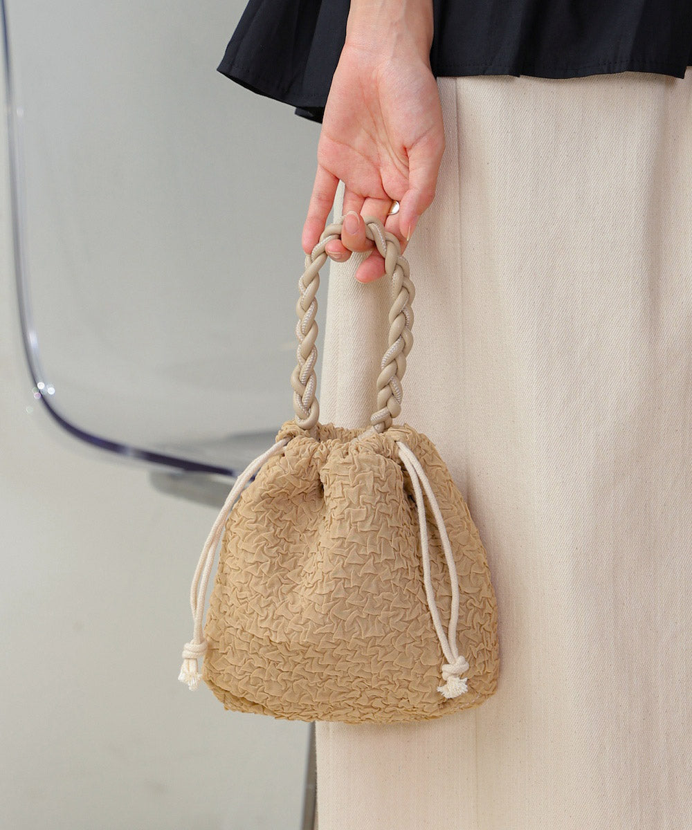 Knitted handle drawstring bag