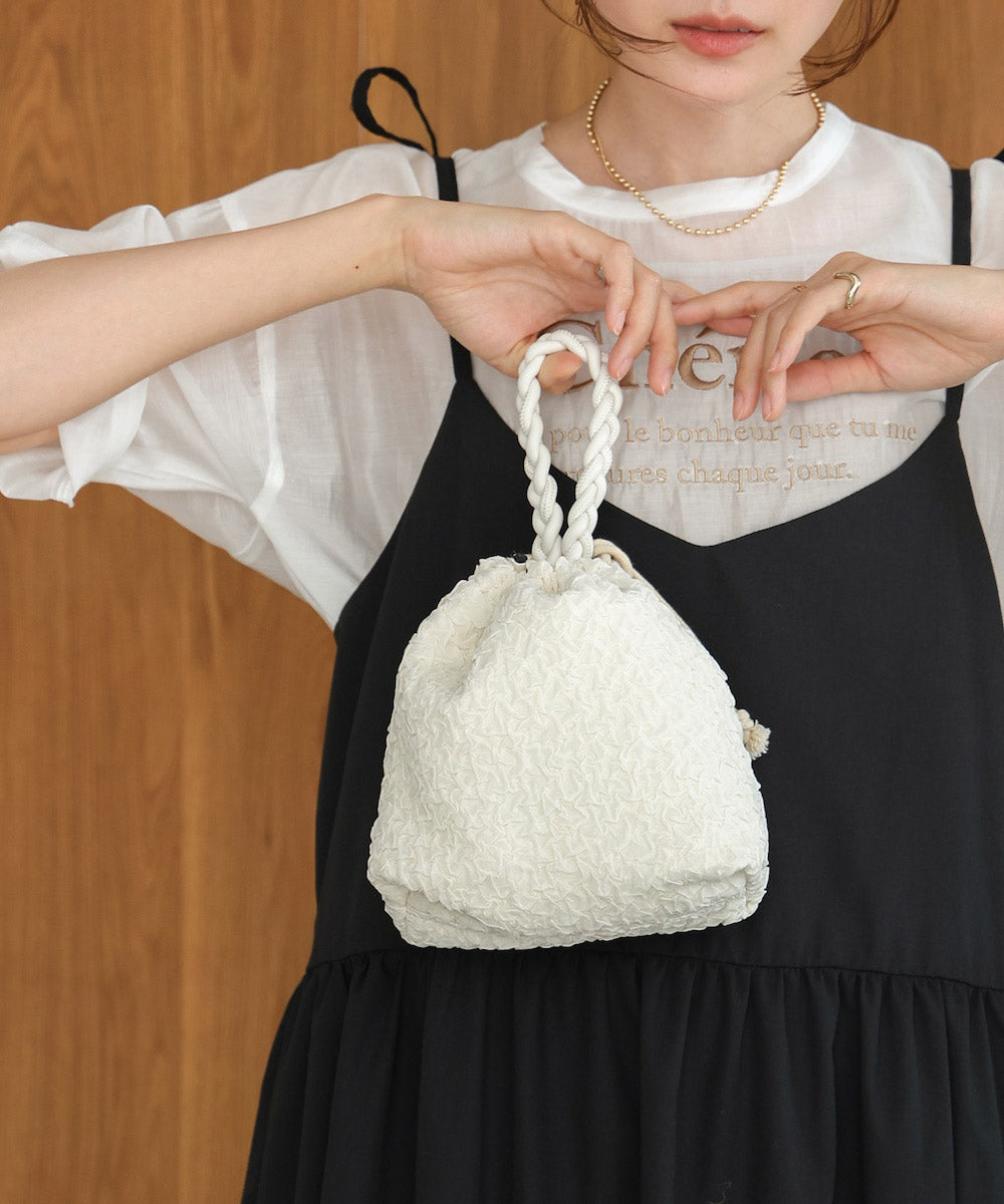 Knitted handle drawstring bag