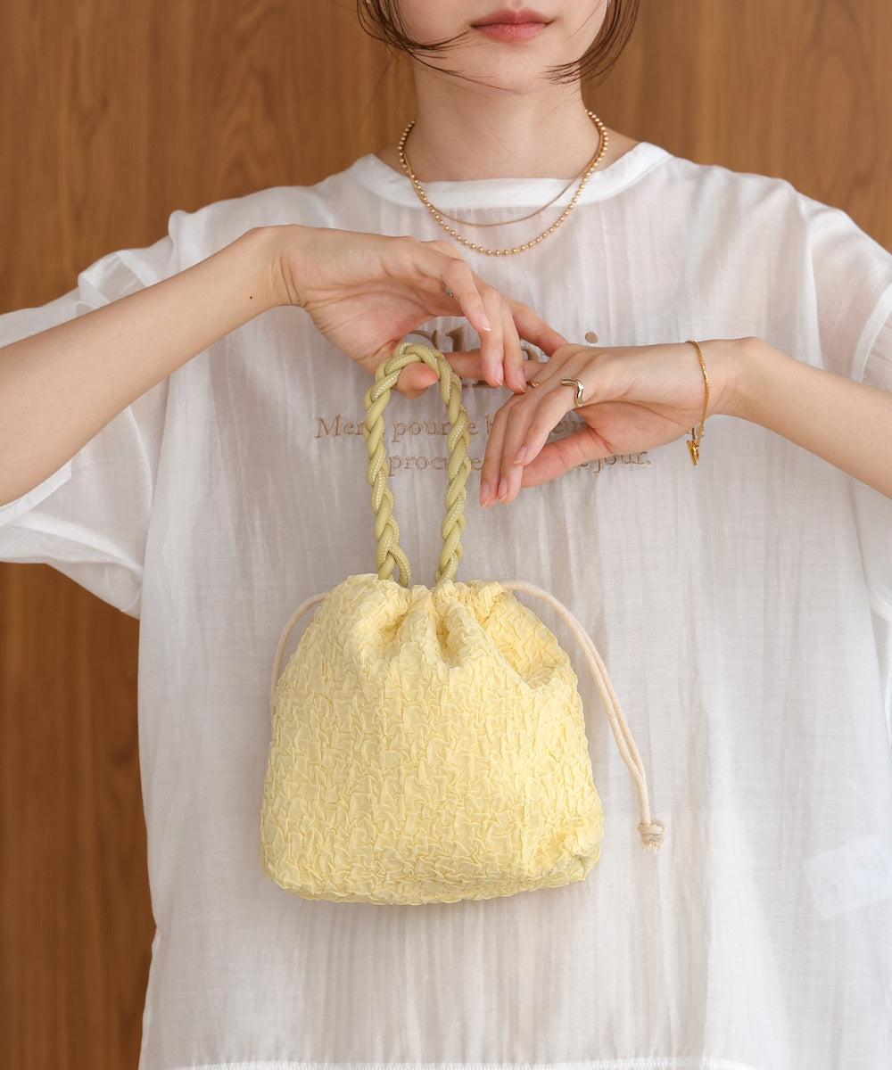 Knitted handle drawstring bag