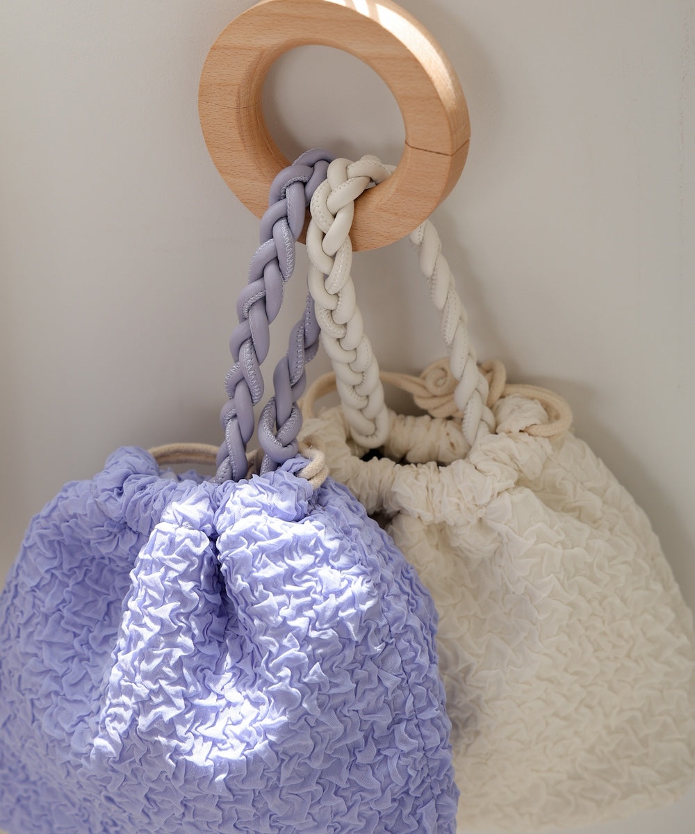 Knitted handle drawstring bag