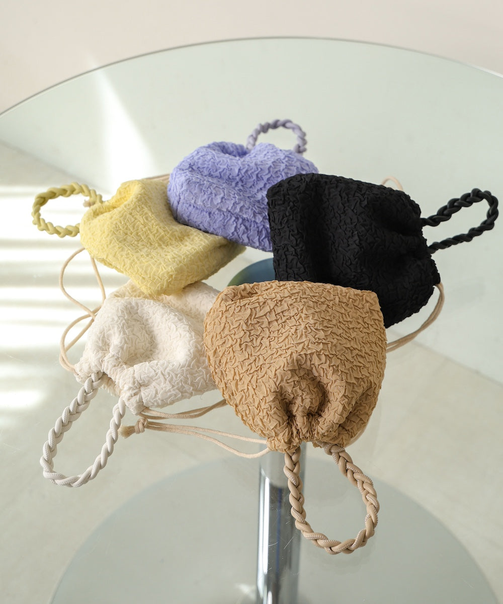 Knitted handle drawstring bag